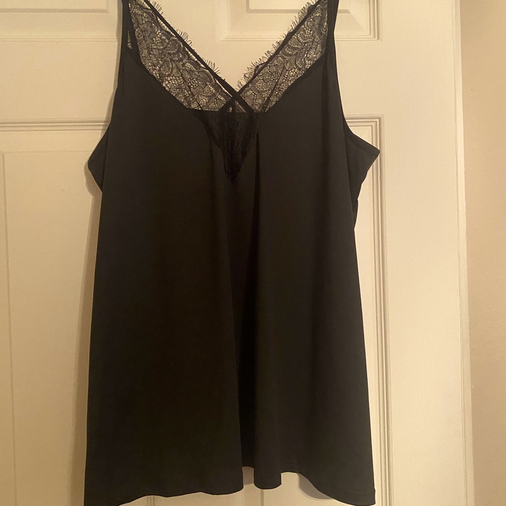 The perfect lacy date night shirt. Black with lace trim on the bust. Size 2XL.